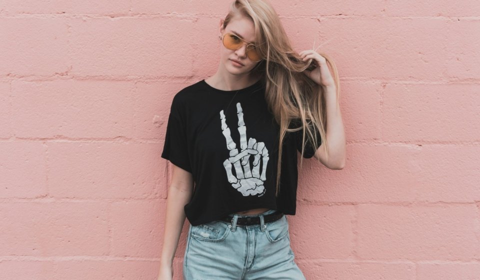 woman standing near pink concrete wall during daytime